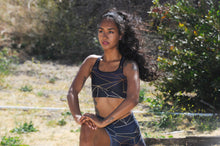 Load image into Gallery viewer, Abstract Black Polygon with Gold Line Padded Sports Bra by The Photo Access