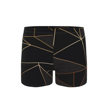 Load image into Gallery viewer, Abstract Black Polygon with Gold Line Swimming Trunks by The Photo Access
