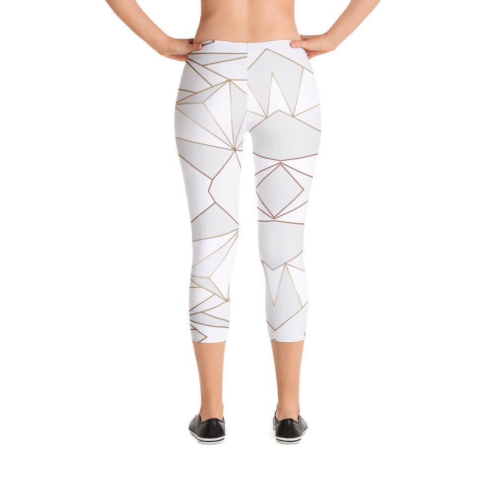 Abstract White Polygon with Gold Line Capri Leggings by The Photo Access